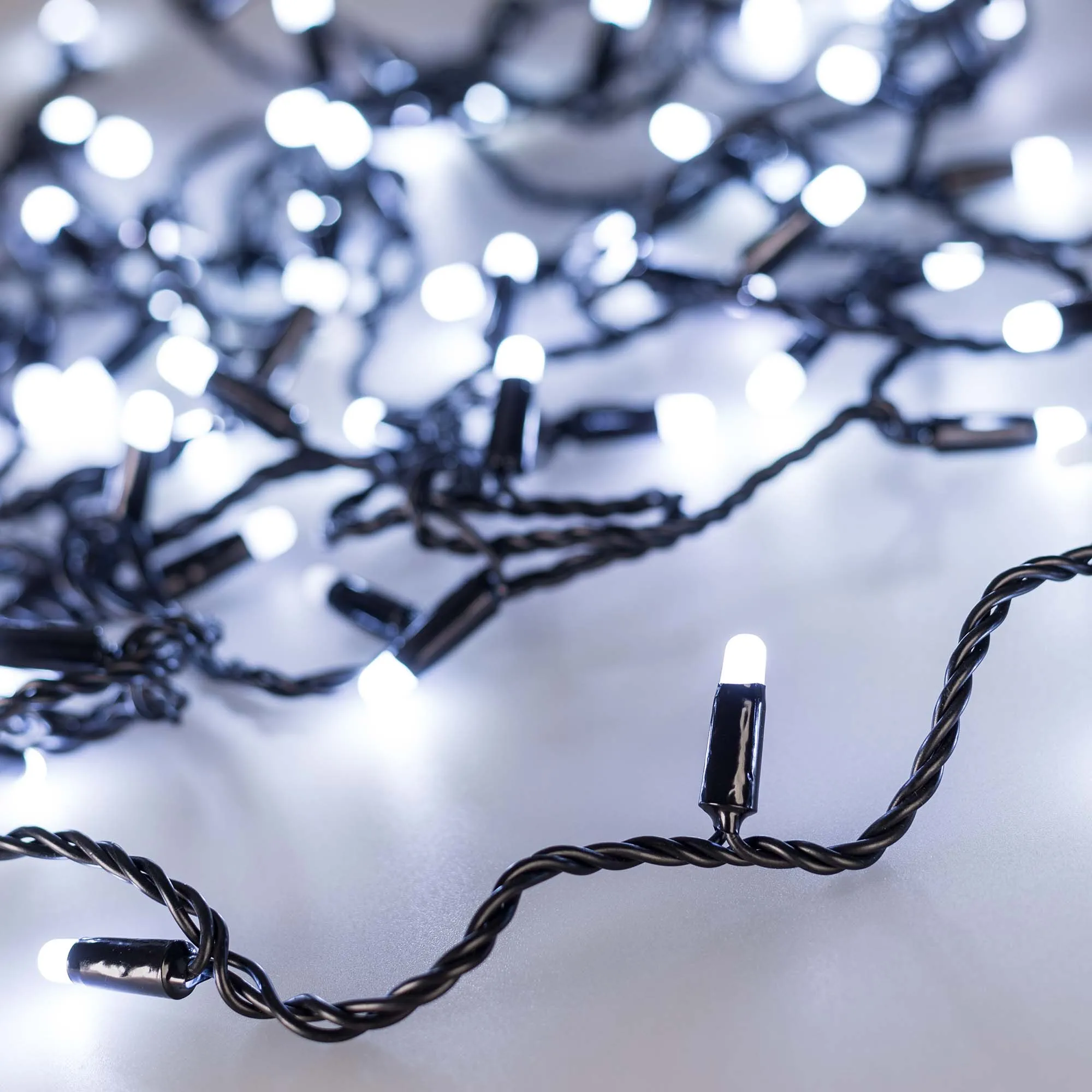 Светодиодная гирлянда ARD-STRING-CLASSIC-10000-BLACK-100LED-MILK-FLASH White (230V, 7W) (Ardecoled, IP65) - изображение товара